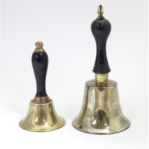 911 - Two early 20thC brass hand bells with ebonised and turned handles. Largest approx. 7