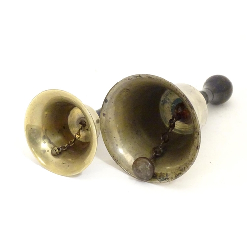 911 - Two early 20thC brass hand bells with ebonised and turned handles. Largest approx. 7