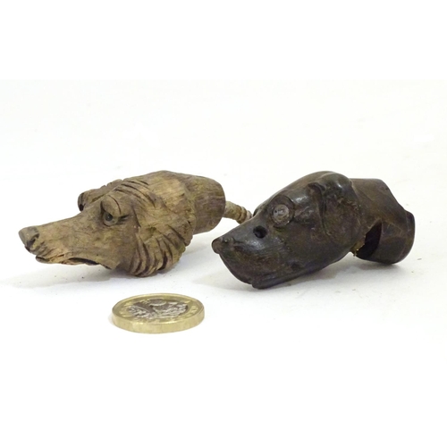 917 - Two late 19th / early 20thC carved wooden dog heads, one a whistle. Largest approx. 2 1/2