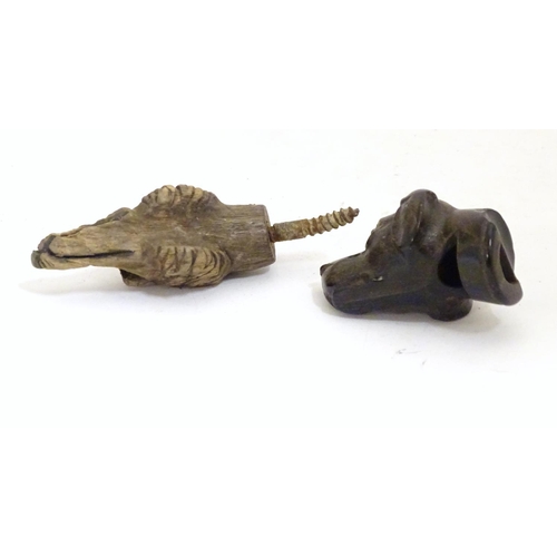 917 - Two late 19th / early 20thC carved wooden dog heads, one a whistle. Largest approx. 2 1/2