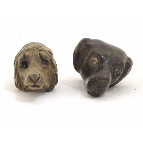 917 - Two late 19th / early 20thC carved wooden dog heads, one a whistle. Largest approx. 2 1/2