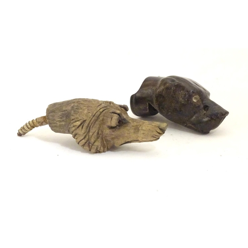 917 - Two late 19th / early 20thC carved wooden dog heads, one a whistle. Largest approx. 2 1/2