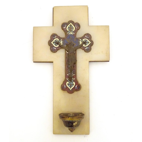 918 - A late 19th / early 20thC champleve enamel crucifix depicting Jesus Christ on the cross with a holy ... 