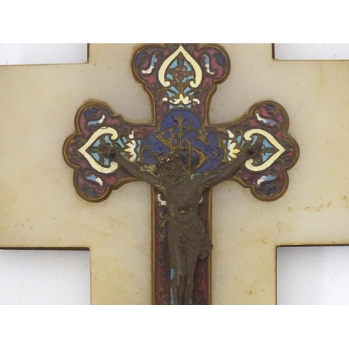 918 - A late 19th / early 20thC champleve enamel crucifix depicting Jesus Christ on the cross with a holy ... 