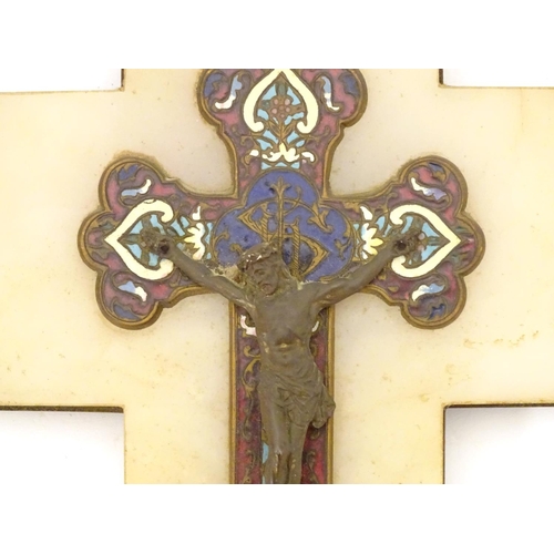 918 - A late 19th / early 20thC champleve enamel crucifix depicting Jesus Christ on the cross with a holy ... 