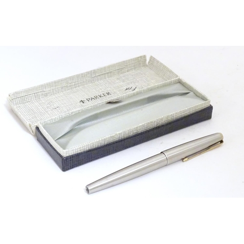 919 - A 20thC Parker convertible fountain pen with 14ct gold 585 nib. Contained within original box, with ... 