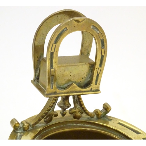 920 - A 19thC brass smoker's companion, comprising ashtray and vesta holder with cast horse shoe and stirr... 