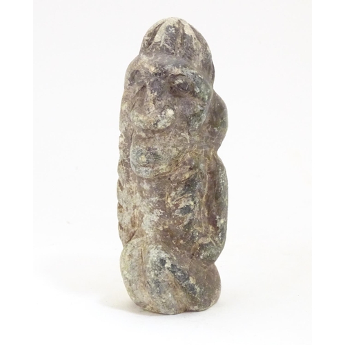 922 - A soapstone carving modelled as a stylised crouching figure. Approx. 5