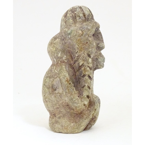 922 - A soapstone carving modelled as a stylised crouching figure. Approx. 5