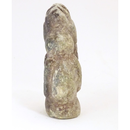 922 - A soapstone carving modelled as a stylised crouching figure. Approx. 5