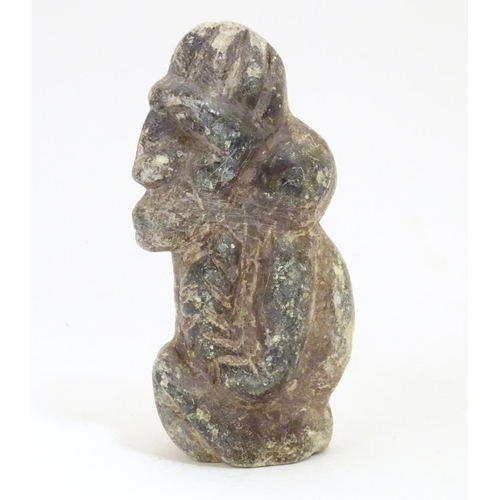 922 - A soapstone carving modelled as a stylised crouching figure. Approx. 5