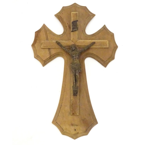 924 - An early 20thC wooden crucifix with a cast model of Jesus Christ on the cross below an INRI scroll m... 