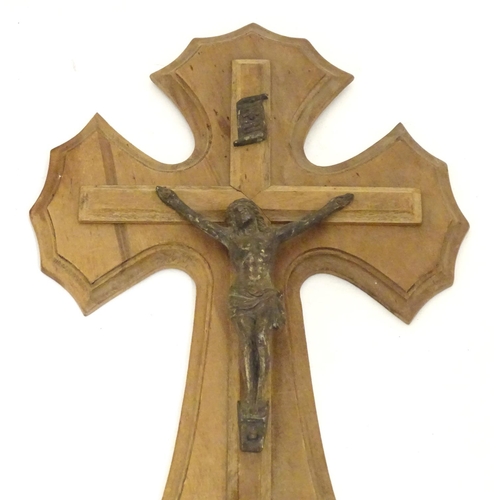 924 - An early 20thC wooden crucifix with a cast model of Jesus Christ on the cross below an INRI scroll m... 