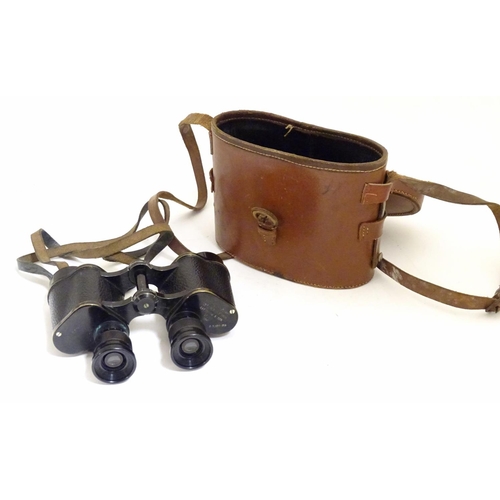 931 - A cased pair of binoculars / Field Glasses by A. Kershaw & Sons, Leeds, stamped 1941, approximately ... 