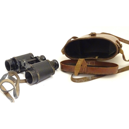 931 - A cased pair of binoculars / Field Glasses by A. Kershaw & Sons, Leeds, stamped 1941, approximately ... 