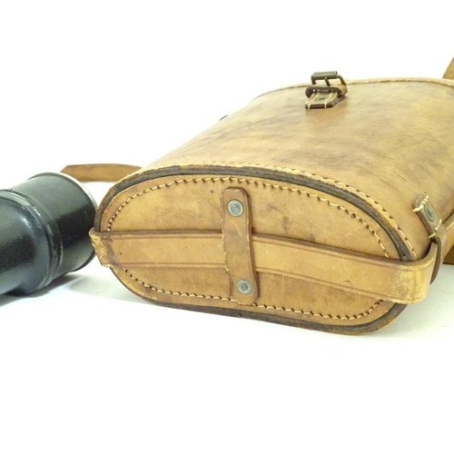 932 - A pair of Binoculars / Field Glasses by Chevalier, Paris, with sunshades and associated leather case