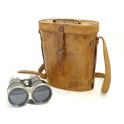 932 - A pair of Binoculars / Field Glasses by Chevalier, Paris, with sunshades and associated leather case