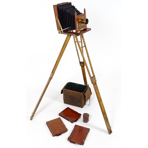 940 - A c1900 plate camera, of mahogany construction, bearing an ivorine plaque inscribed 'The Society - T... 