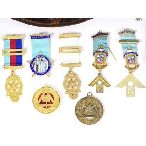 944 - A large quantity of Freemasons / Masonic regalia, to include aprons, sashes, collars, collars with p... 