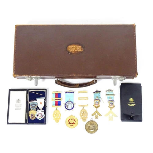 944 - A large quantity of Freemasons / Masonic regalia, to include aprons, sashes, collars, collars with p... 