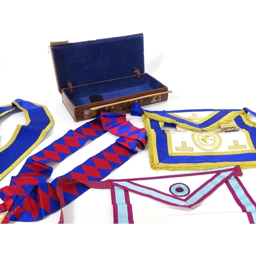 944 - A large quantity of Freemasons / Masonic regalia, to include aprons, sashes, collars, collars with p... 