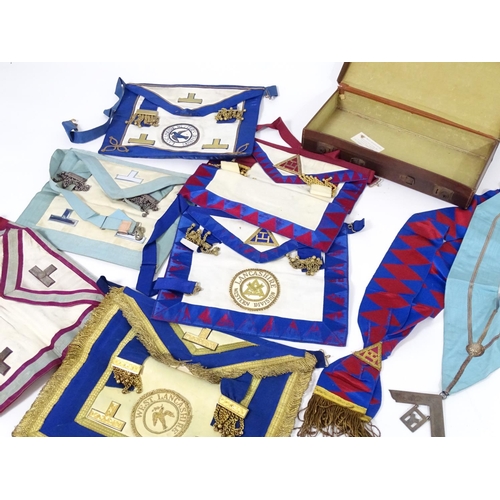 944 - A large quantity of Freemasons / Masonic regalia, to include aprons, sashes, collars, collars with p... 