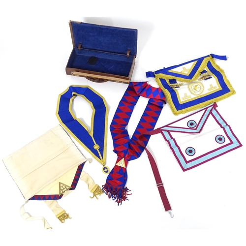 944 - A large quantity of Freemasons / Masonic regalia, to include aprons, sashes, collars, collars with p... 