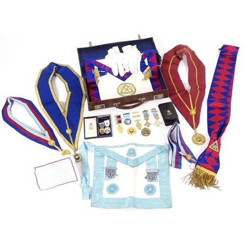 944 - A large quantity of Freemasons / Masonic regalia, to include aprons, sashes, collars, collars with p... 