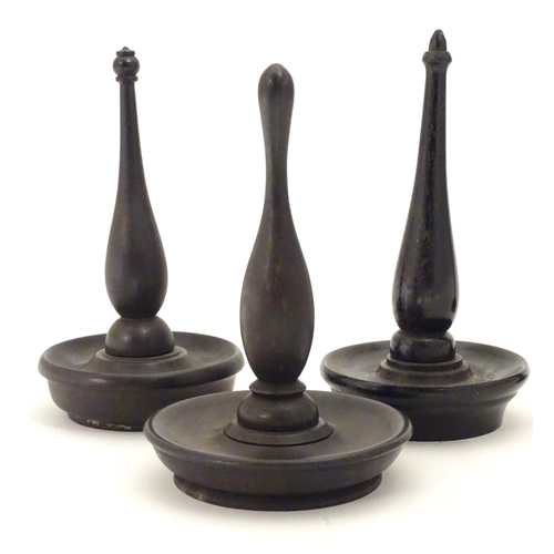 949 - Four items of early 20thC treen, comprising three ring trees / jewellery holders and a spill vase. V... 