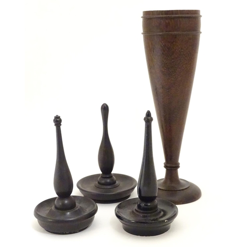 949 - Four items of early 20thC treen, comprising three ring trees / jewellery holders and a spill vase. V... 