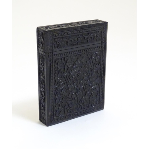 952 - A Victorian ebonised card case with floral and foliate carved detail. Approx. 4 1/4