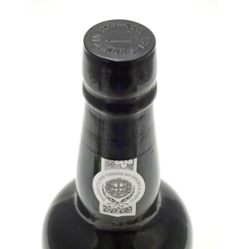 1136 - A 75cl bottle Sandemans vintage 1966 port, in presentation case, the lid inset with barman's tools (... 