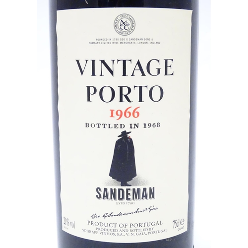 1136 - A 75cl bottle Sandemans vintage 1966 port, in presentation case, the lid inset with barman's tools (... 