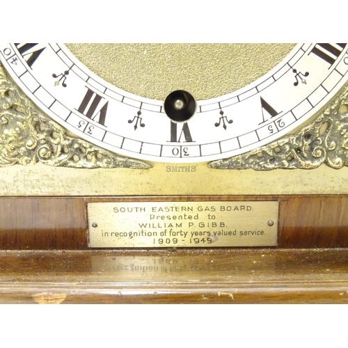 1175 - A 20thC Smiths walnut cased bracket clock in walnut case with silvered Roman chapter ring , hammered... 