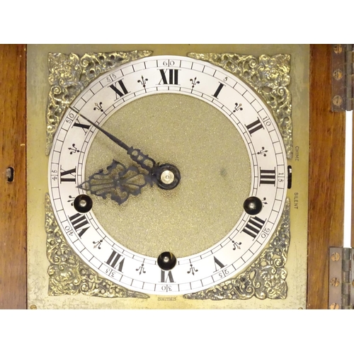 1175 - A 20thC Smiths walnut cased bracket clock in walnut case with silvered Roman chapter ring , hammered... 