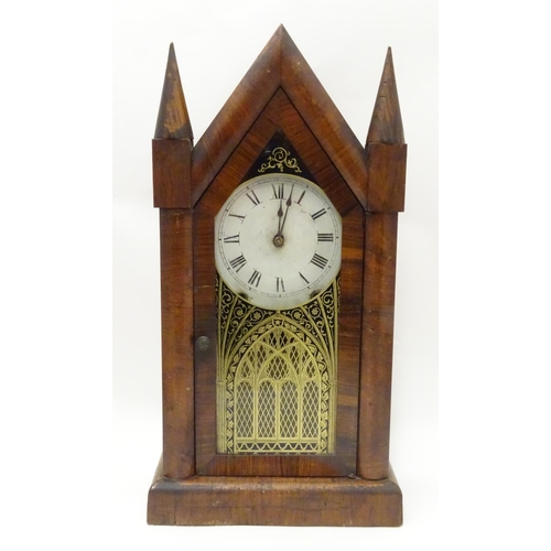 1180 - An American mantle clock with glazed door and having paper trade label to interior for 'Jerome & Co.... 