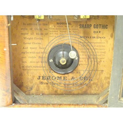 1180 - An American mantle clock with glazed door and having paper trade label to interior for 'Jerome & Co.... 