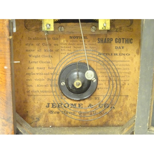 1180 - An American mantle clock with glazed door and having paper trade label to interior for 'Jerome & Co.... 