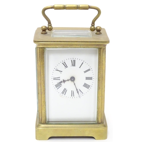 1181 - A 20thC brass cased carriage clock / timepiece . 5 1/2