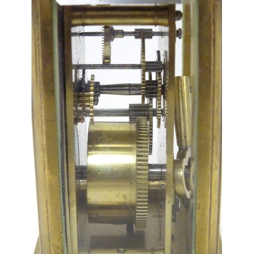 1181 - A 20thC brass cased carriage clock / timepiece . 5 1/2