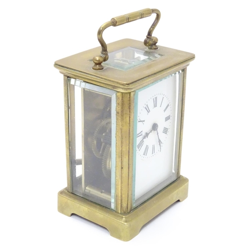 1181 - A 20thC brass cased carriage clock / timepiece . 5 1/2