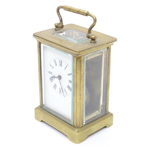 1181 - A 20thC brass cased carriage clock / timepiece . 5 1/2