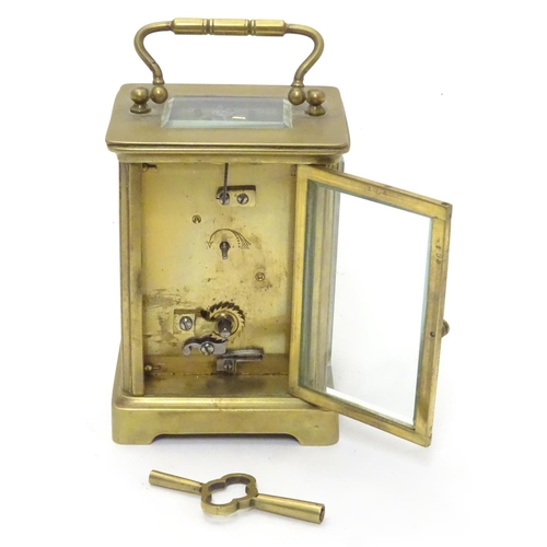 1181 - A 20thC brass cased carriage clock / timepiece . 5 1/2