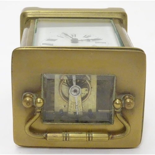 1181 - A 20thC brass cased carriage clock / timepiece . 5 1/2