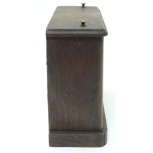 1183 - A 1920's / 30's oak cased chess clock by HAC Hamburg American Clock Company with crossed arrows trad... 