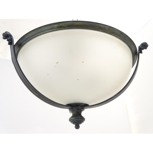 1202 - A pair of ceiling lights with frosted glass domed shades and metal strap work 18