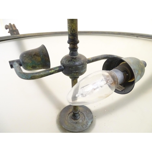 1202 - A pair of ceiling lights with frosted glass domed shades and metal strap work 18