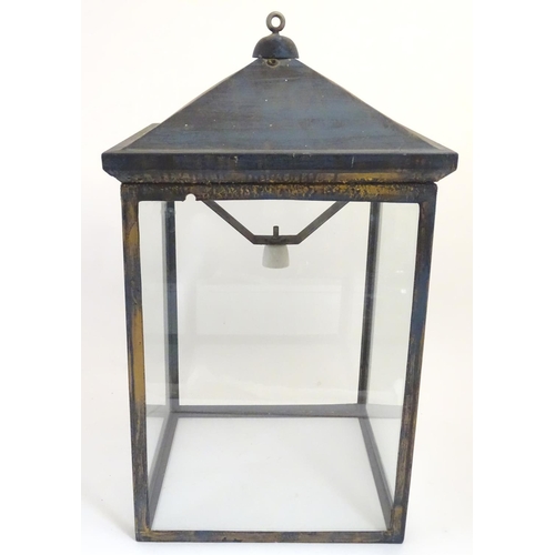 1205 - An early 20thC  large hanging light of lantern form with four glass panels. The whole Approx 32