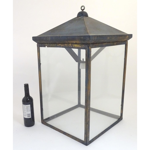 1205 - An early 20thC  large hanging light of lantern form with four glass panels. The whole Approx 32