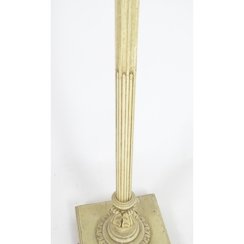 1221 - A carved and painted wooded standard lamp with reeded column on a squared base. Approx 60